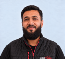 Mohammed, owner of AutoNiche, wearing an AutoNiche jacket