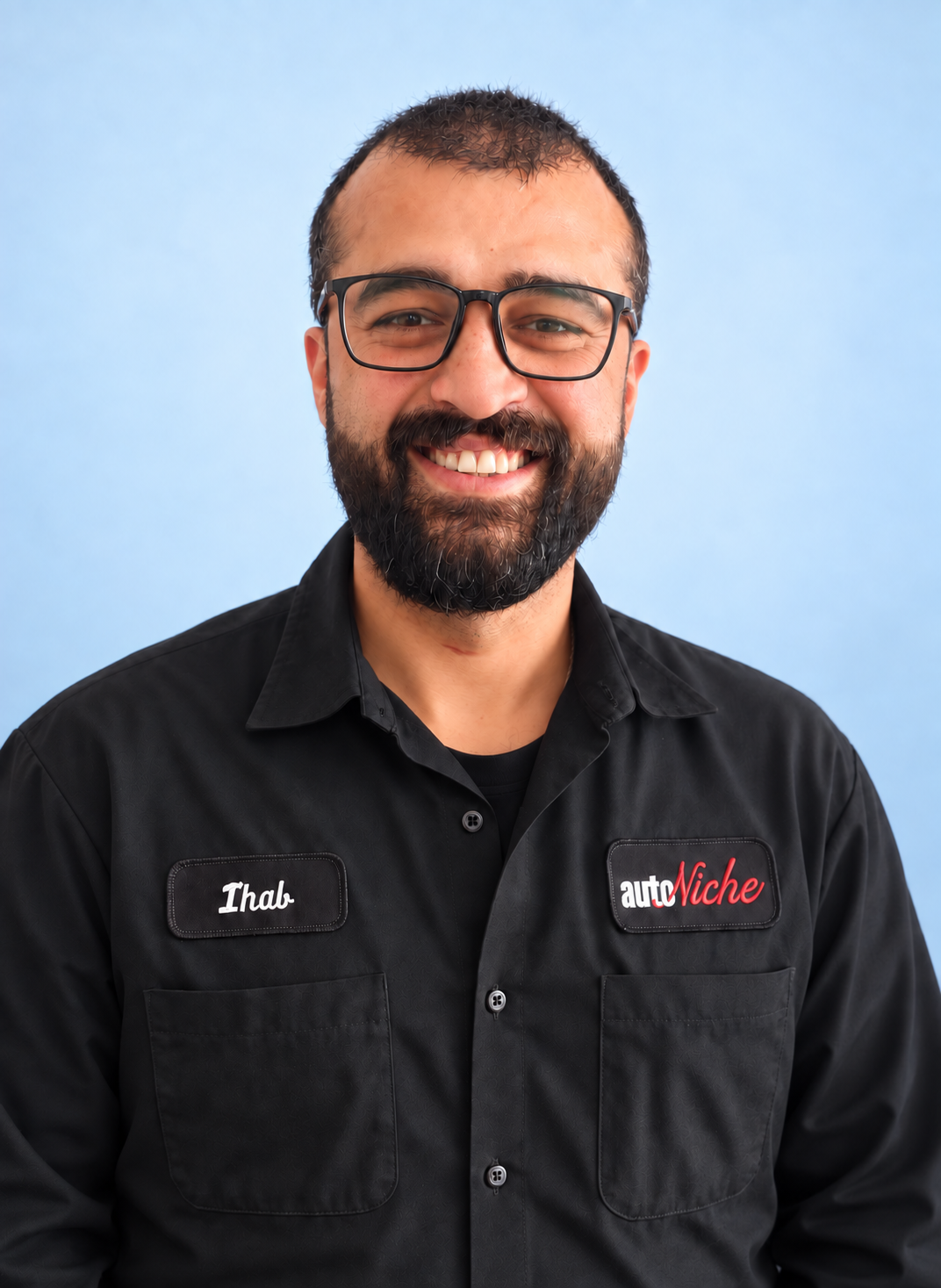 Ihab, Automotive Service Technician Apprentice at AutoNiche, wearing his AutoNiche uniform